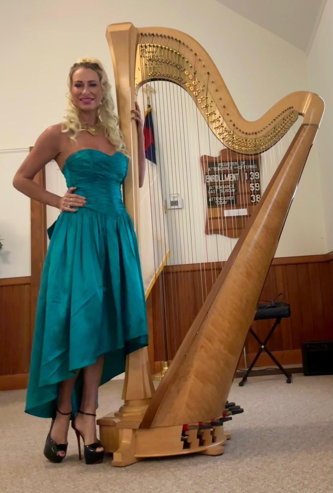 Julia White performing on harp